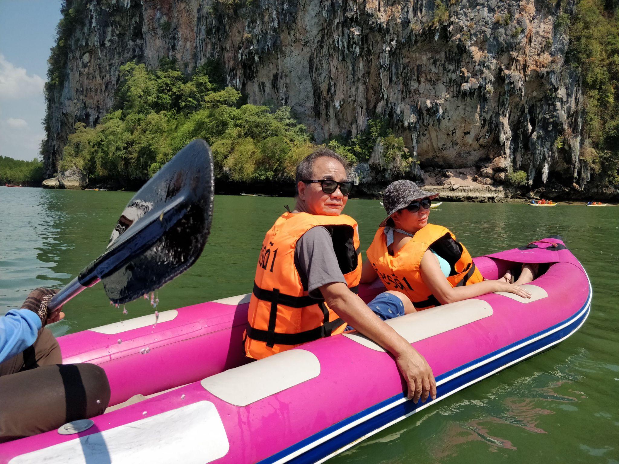 Cherry's parents kayaking through the limestone cliffs of Phang Nga Bay near Phuket.
