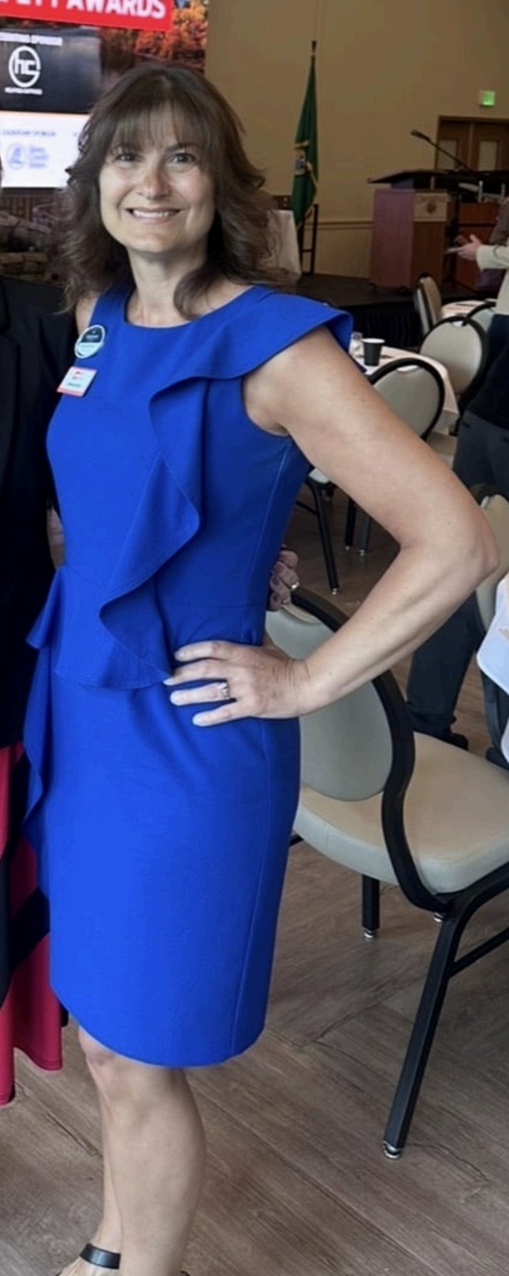 Brenda six months post-op in a blue dress, 138 lb