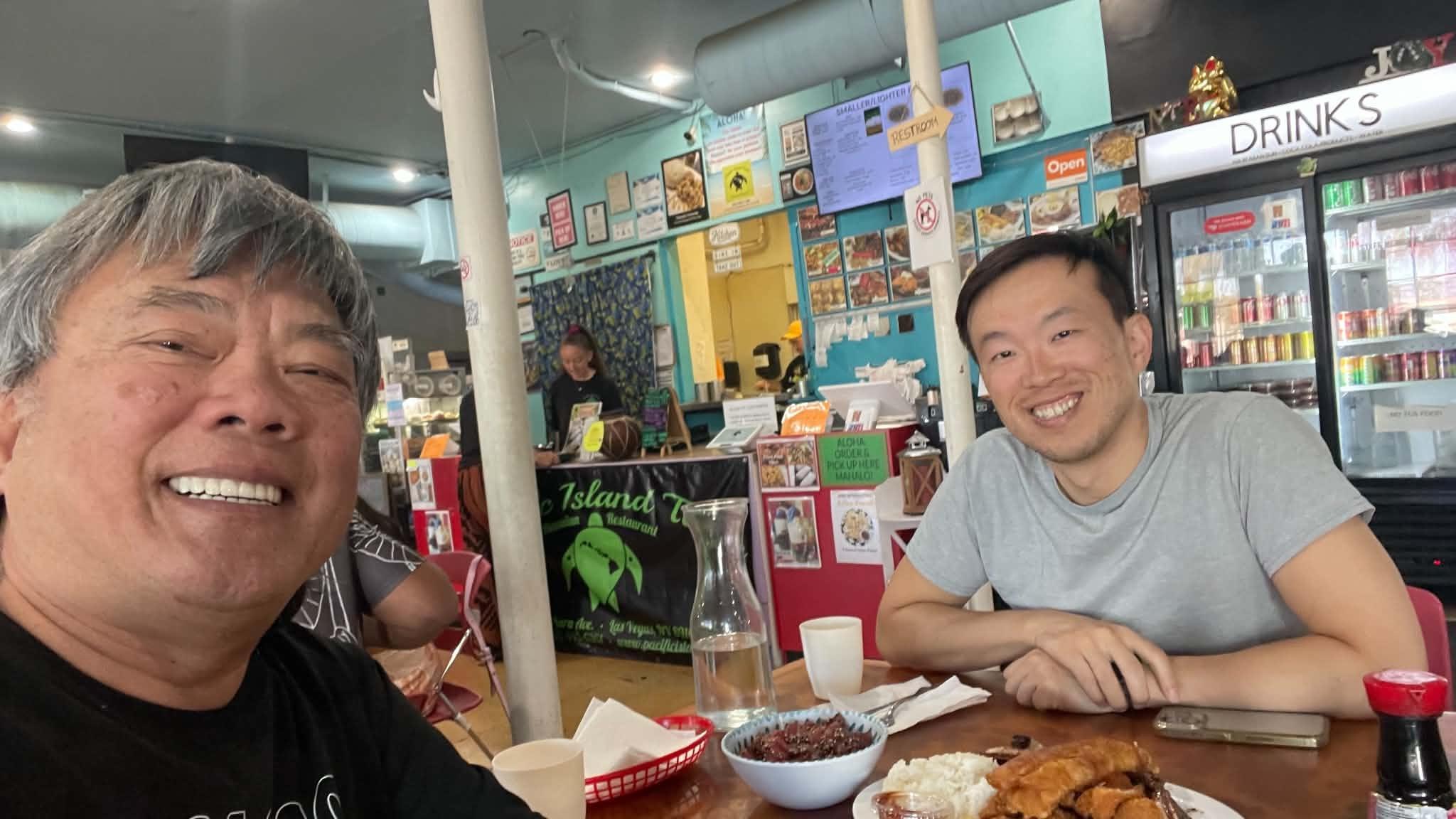 Sam having lunch with his son at a casual restaurant