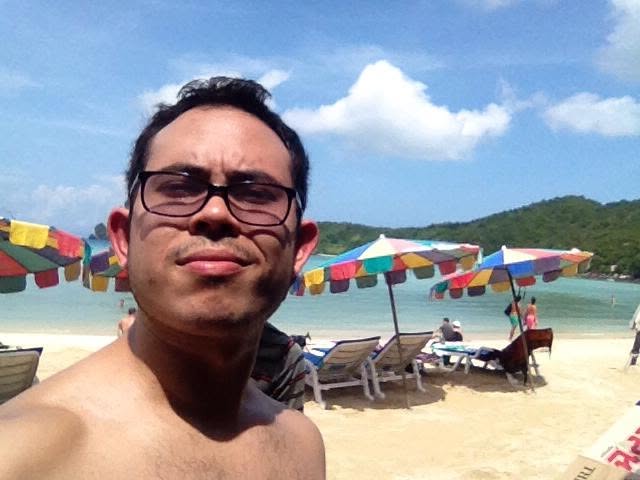 Tony taking a selfie on a beach in Thailand