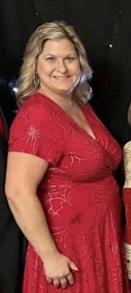 Brenda at 223 lb in a red dress, before her weight loss journey