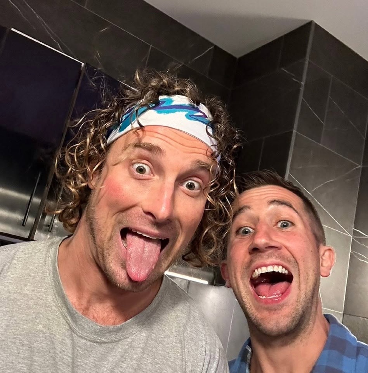 George taking a selfie with a friend
