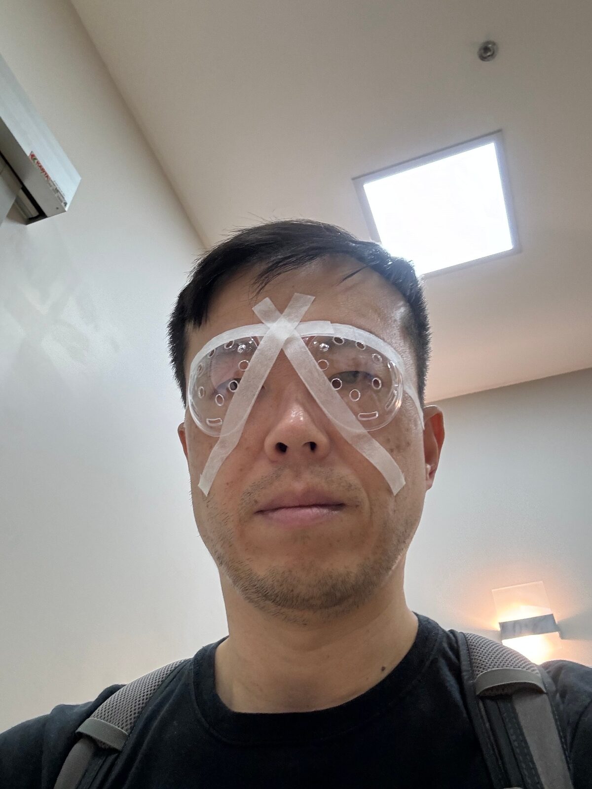 Joe wearing protective taped goggles right after the LASIK procedure